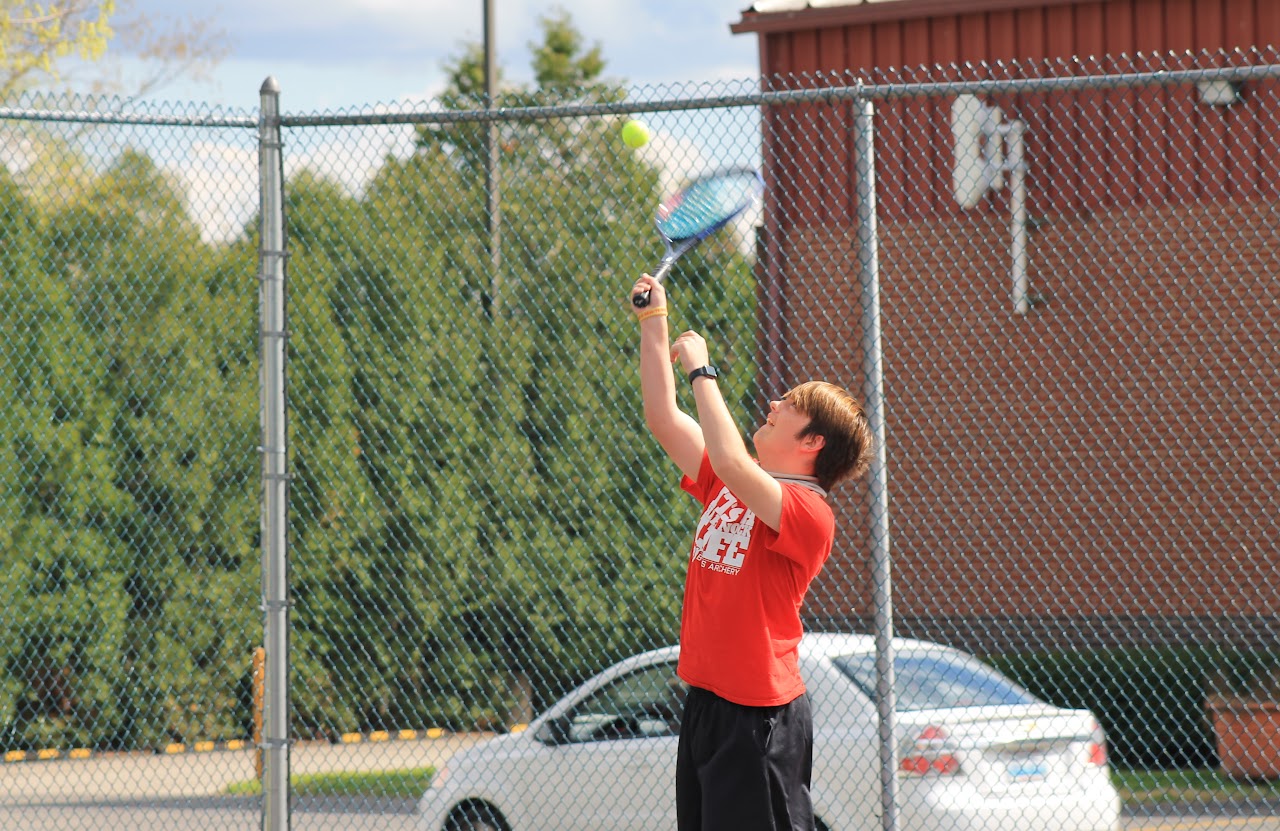 player jumping to hit the ball