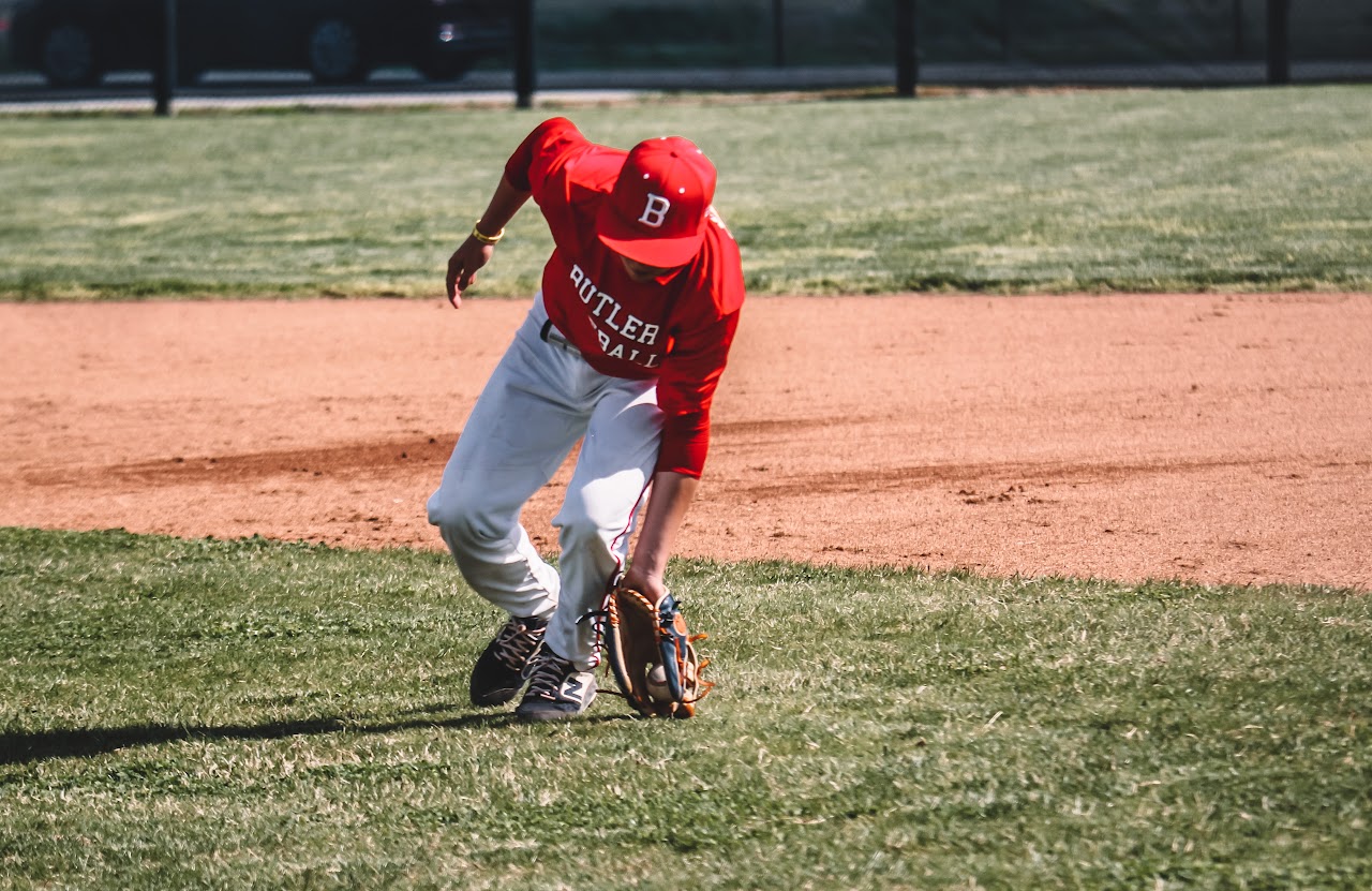 player catching the ball on the ground