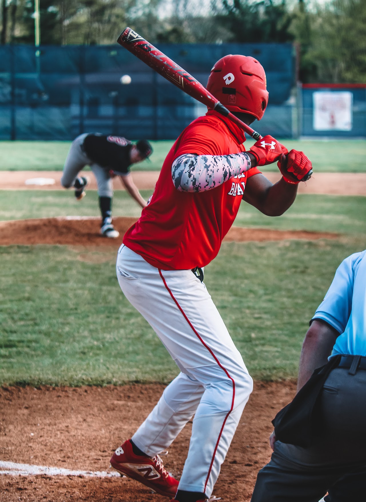 player in home plate ready to hit the ball