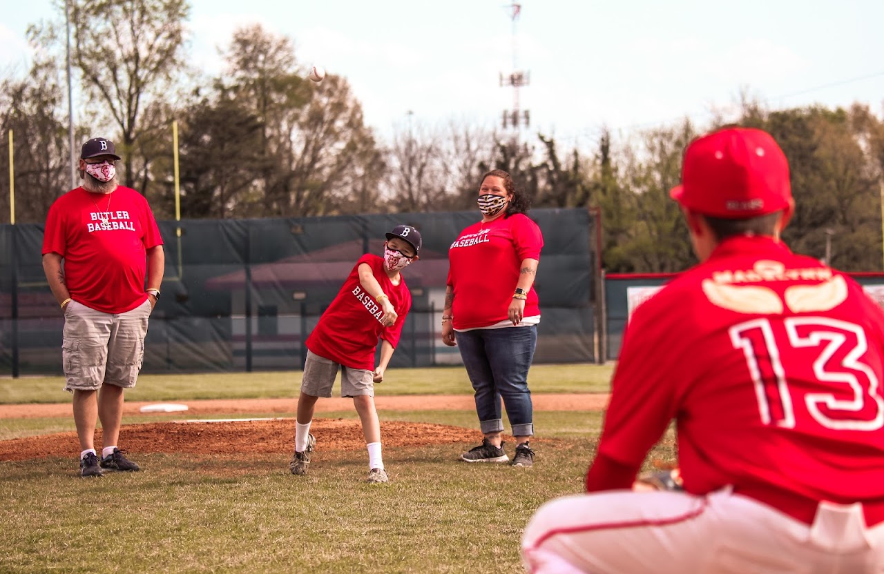 kid throwing the ball to the catcher