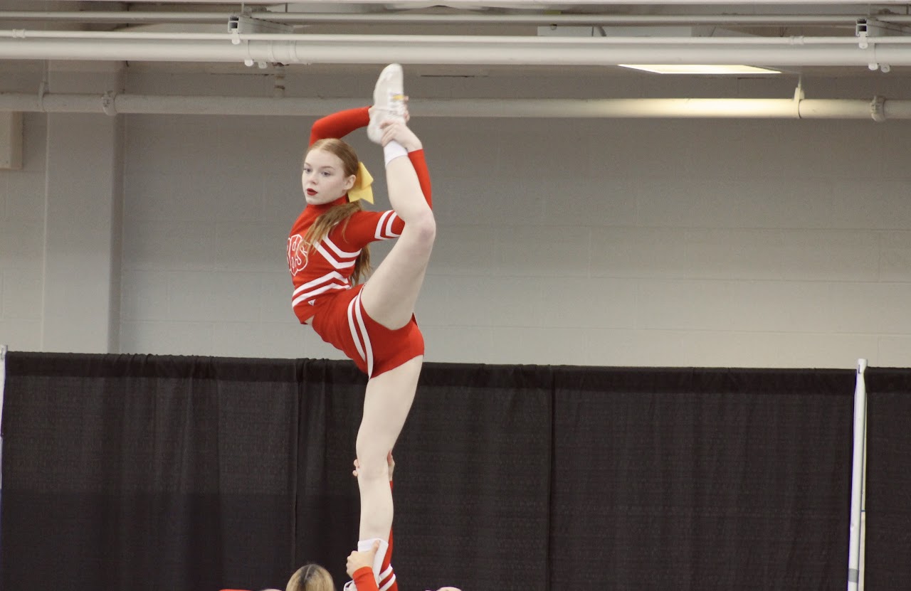 Cheerleader getting his leg to his head