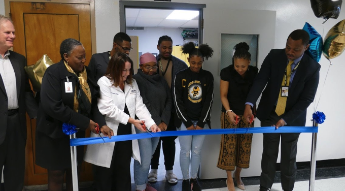 Students, officials with Park DuValle Health Center and Central High cut the ribbon on an in-school health clinic.