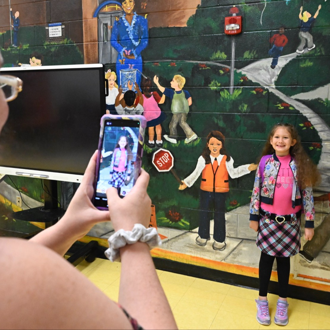 Parent taking students photo