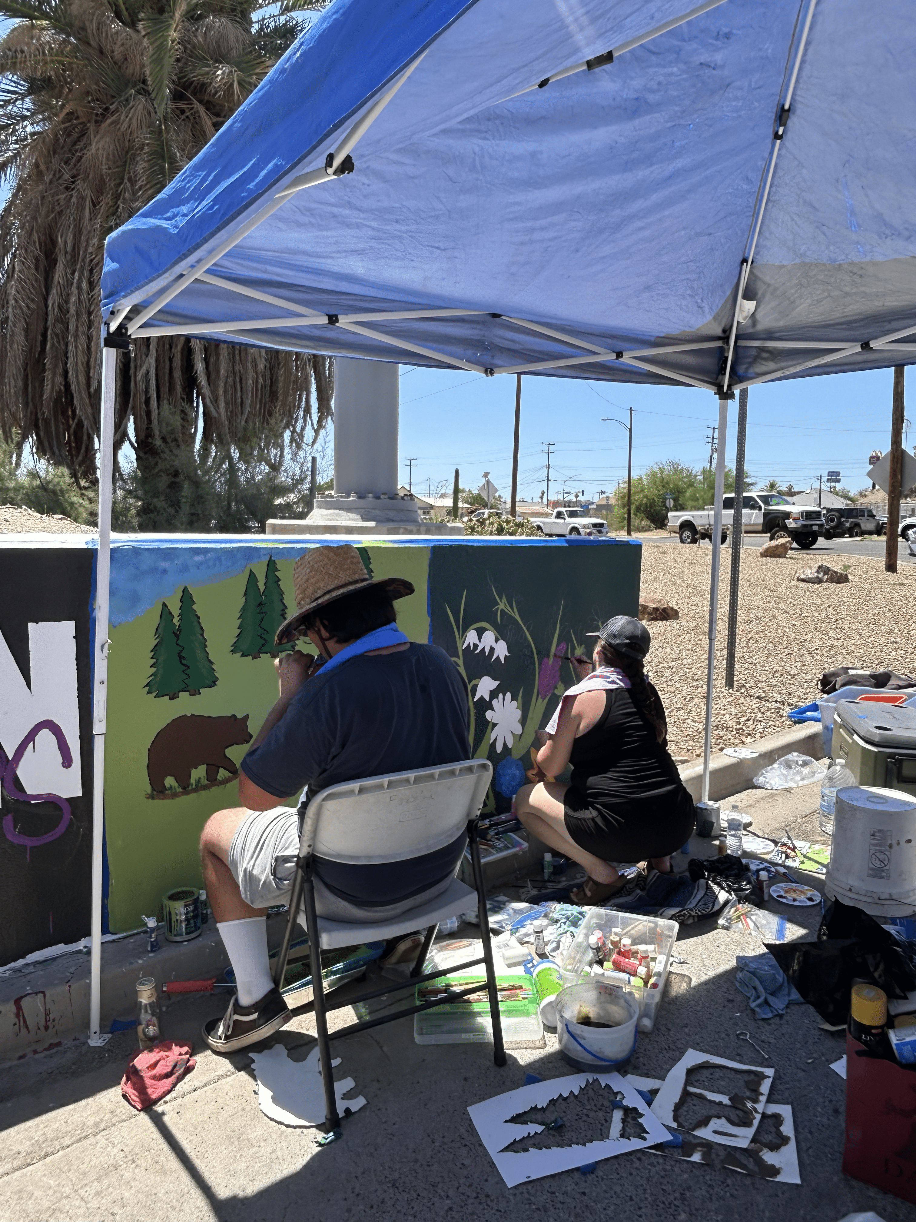 Students painting underpass.