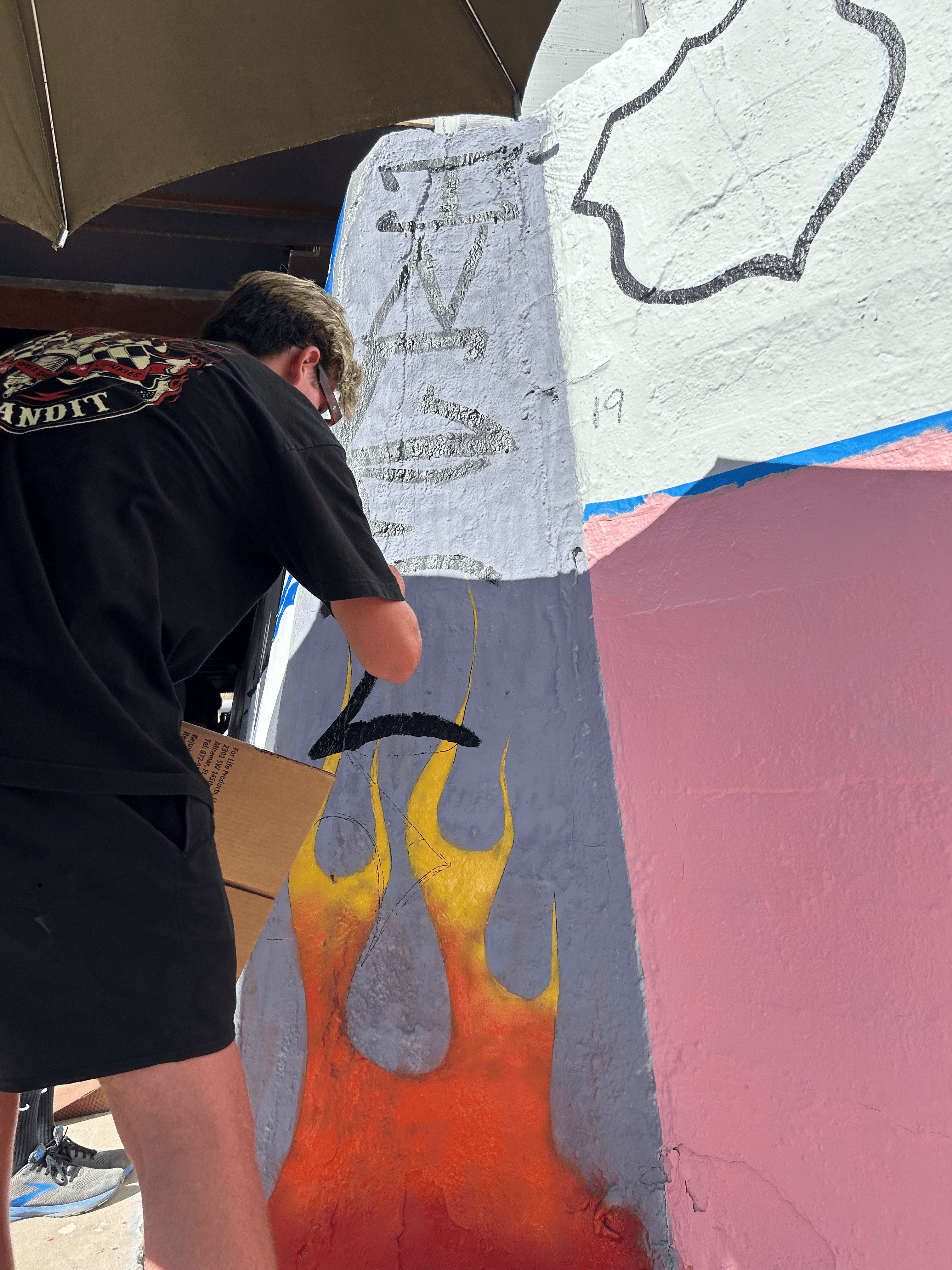 Students painting underpass.