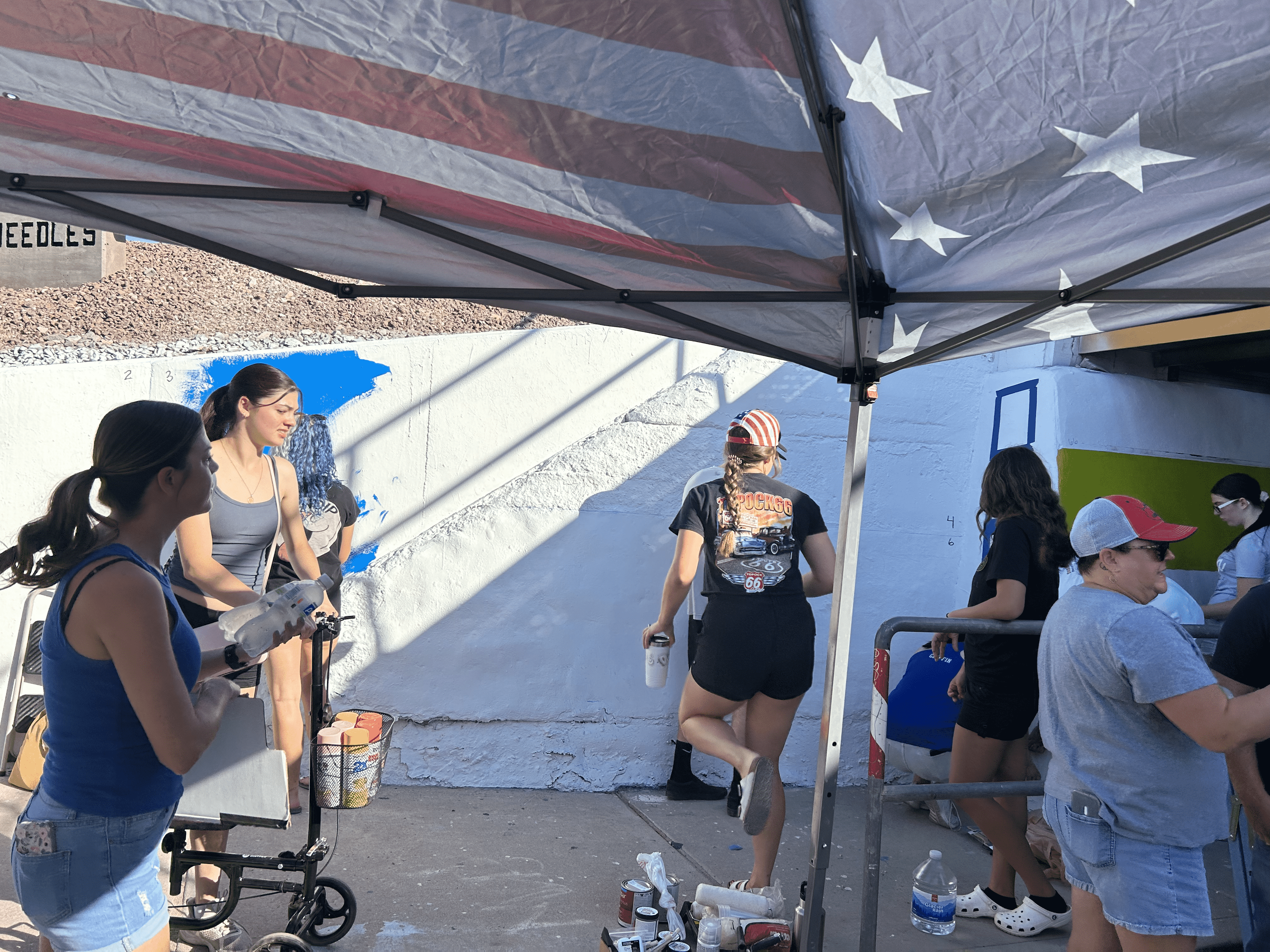 Students painting underpass.