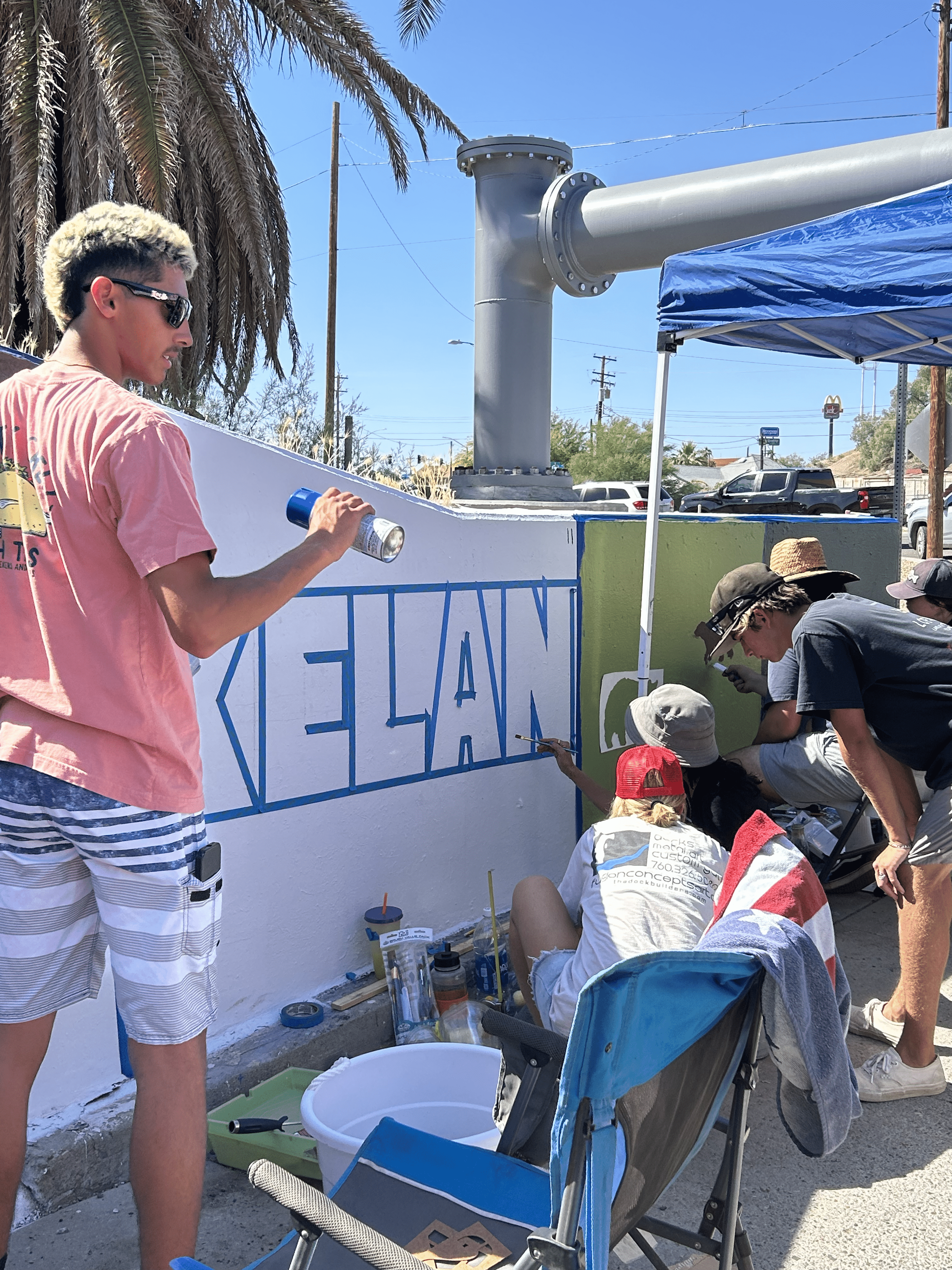 Students painting underpass.