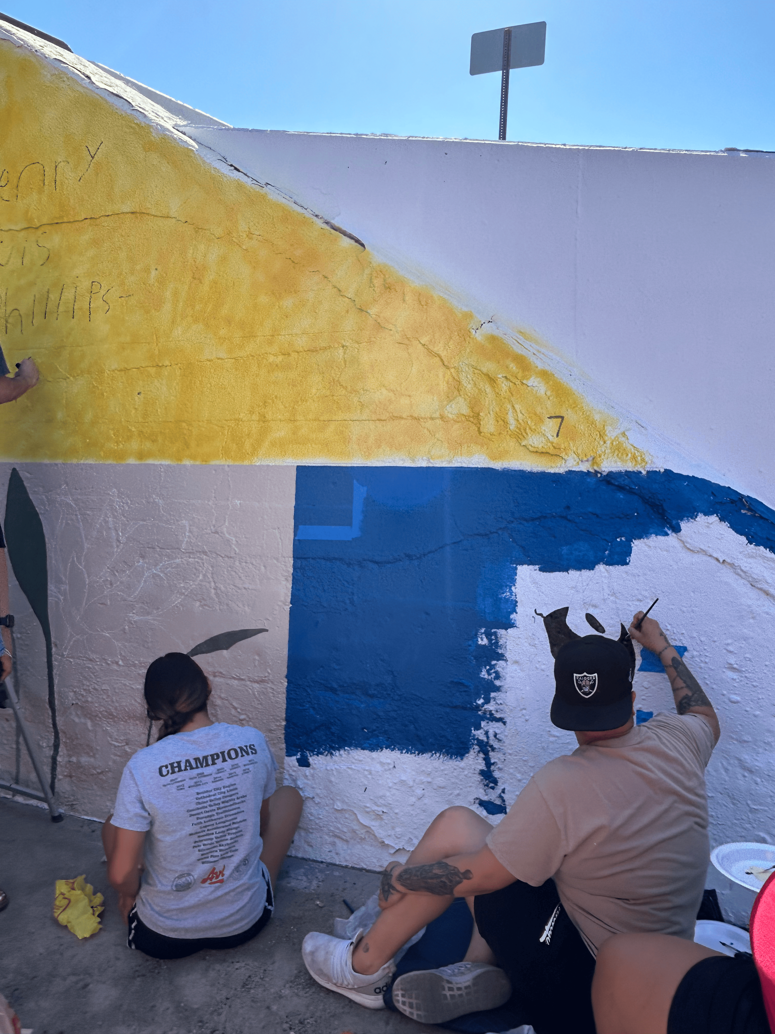 Students painting underpass.