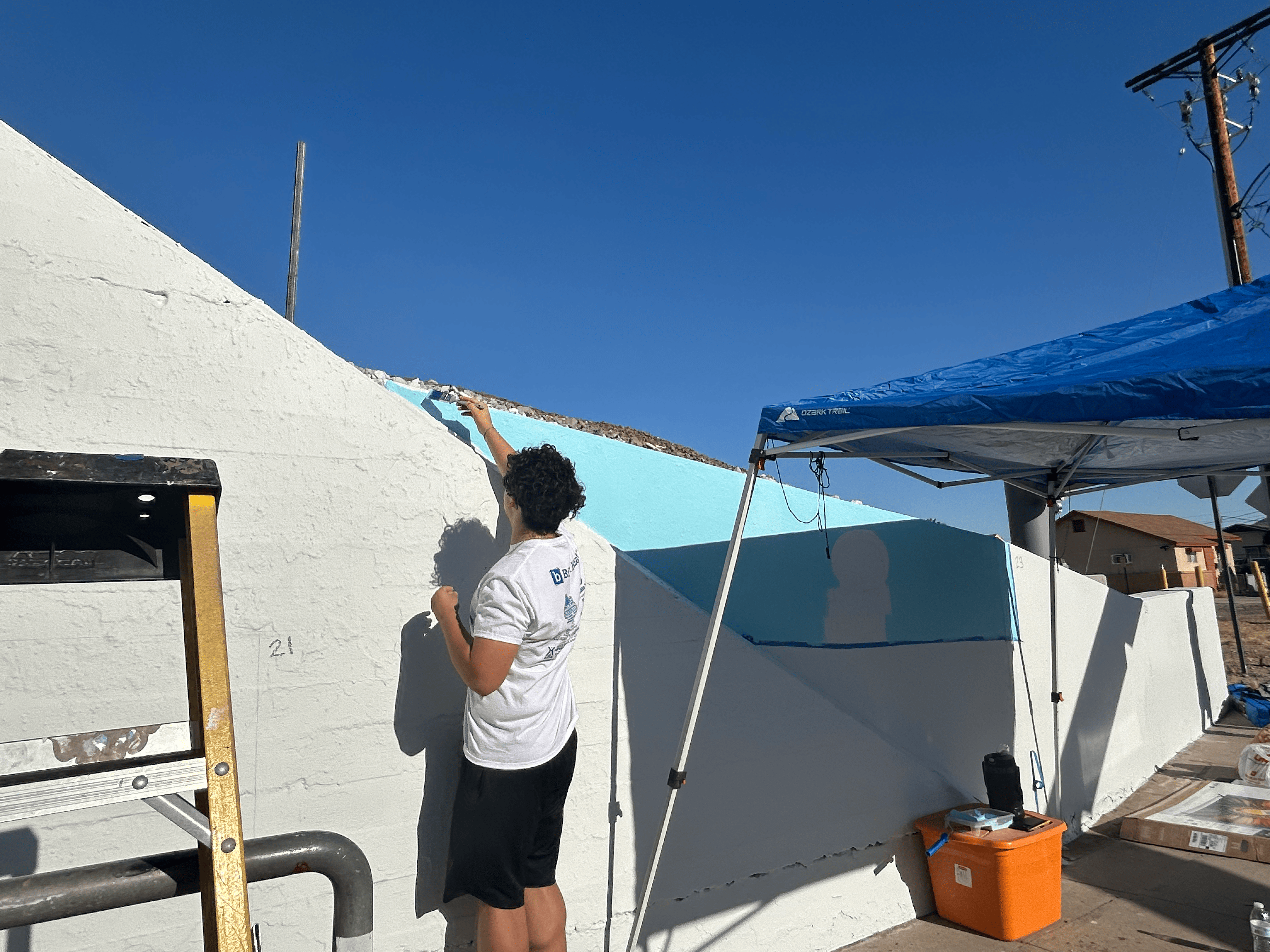 Students painting underpass.