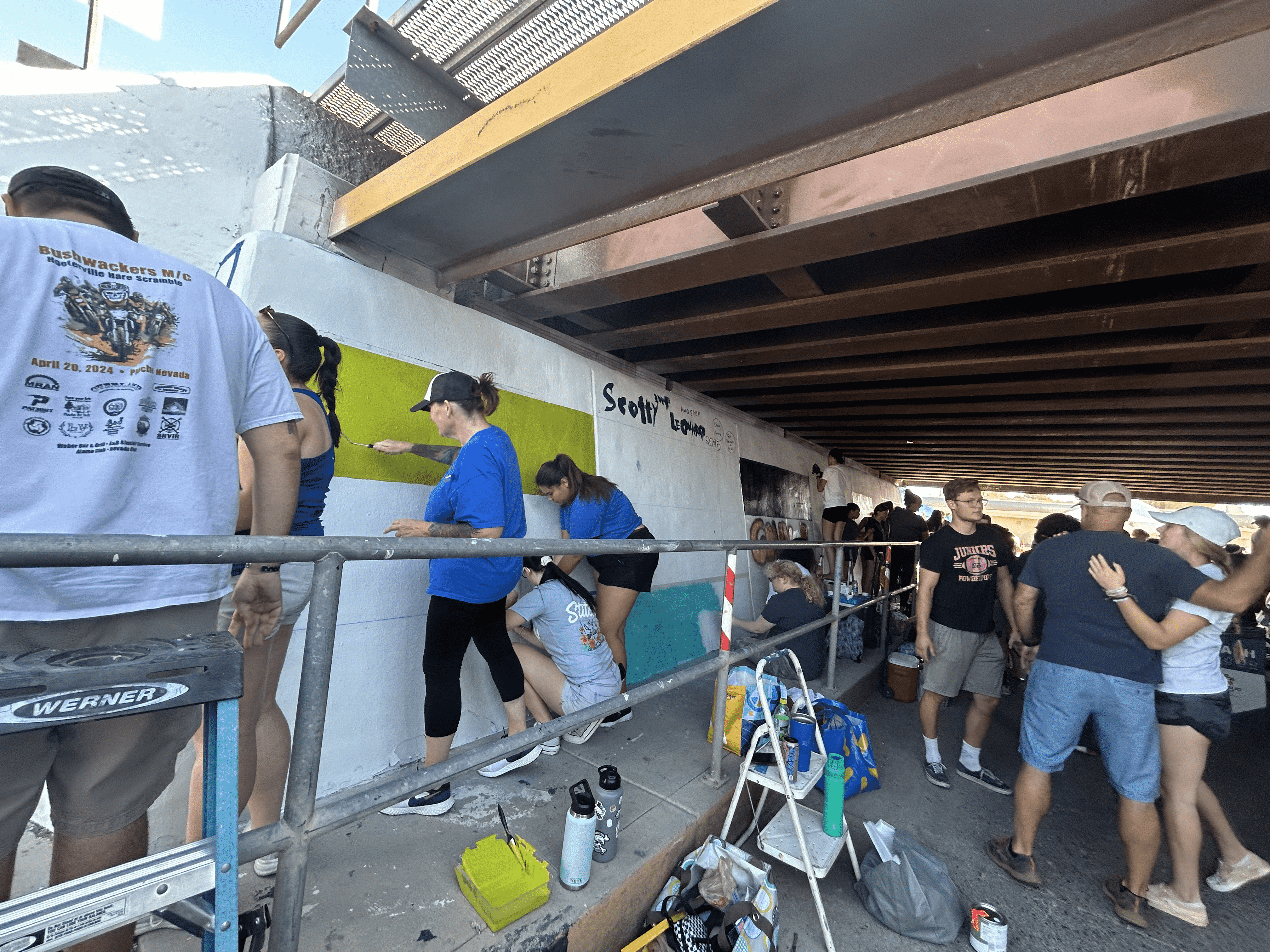 Students painting underpass.