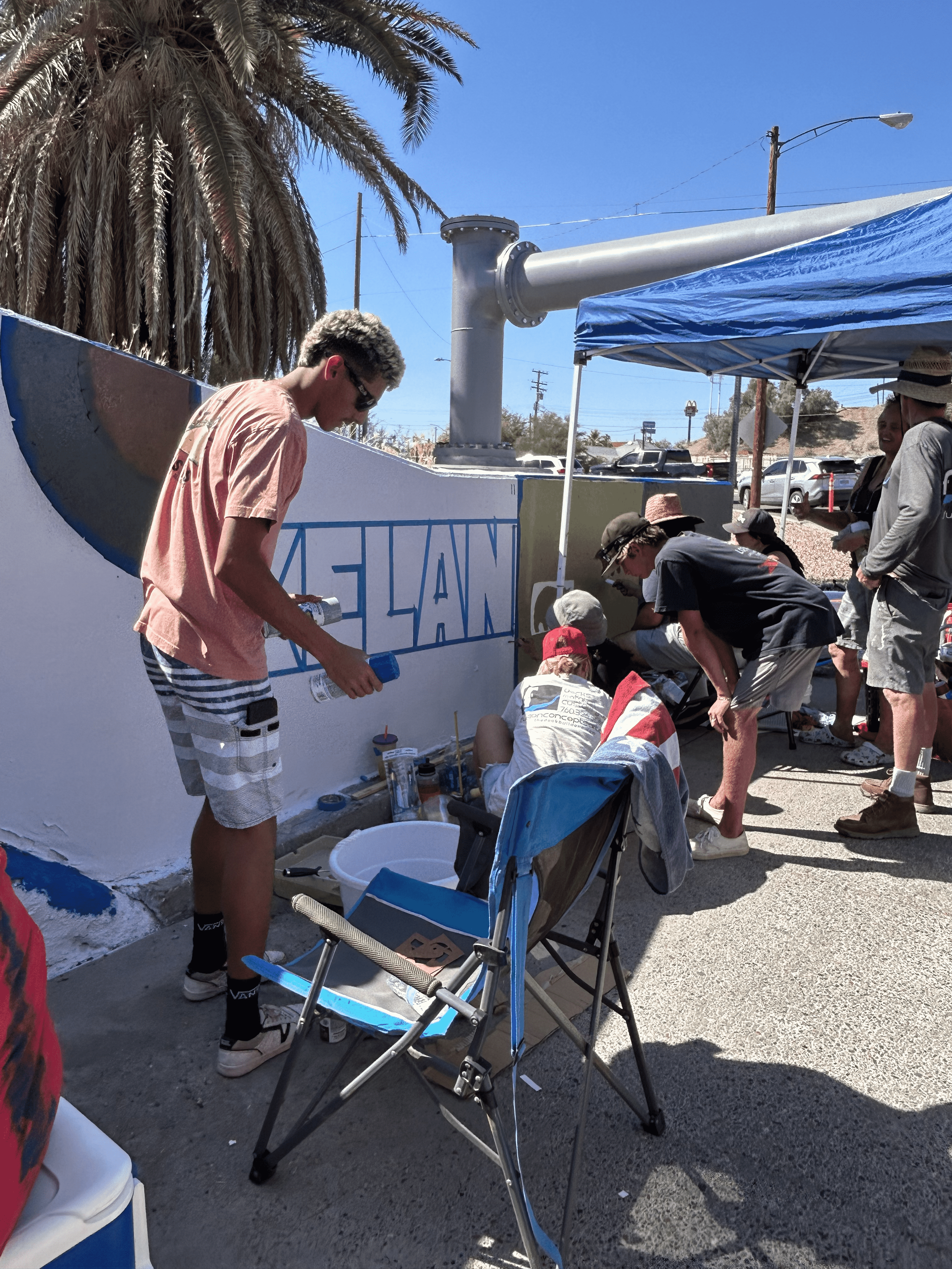 Students painting underpass.