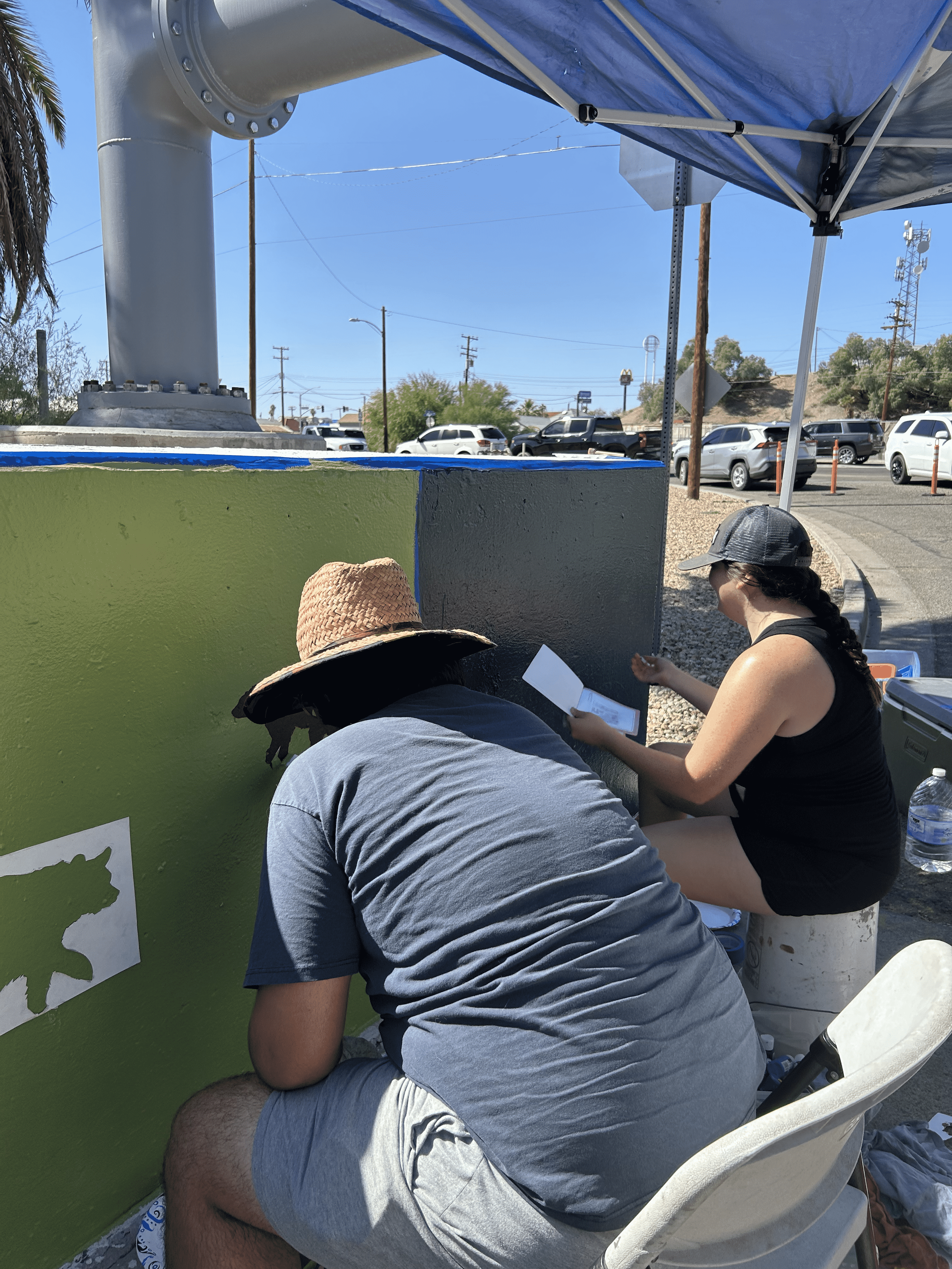 Students painting underpass.