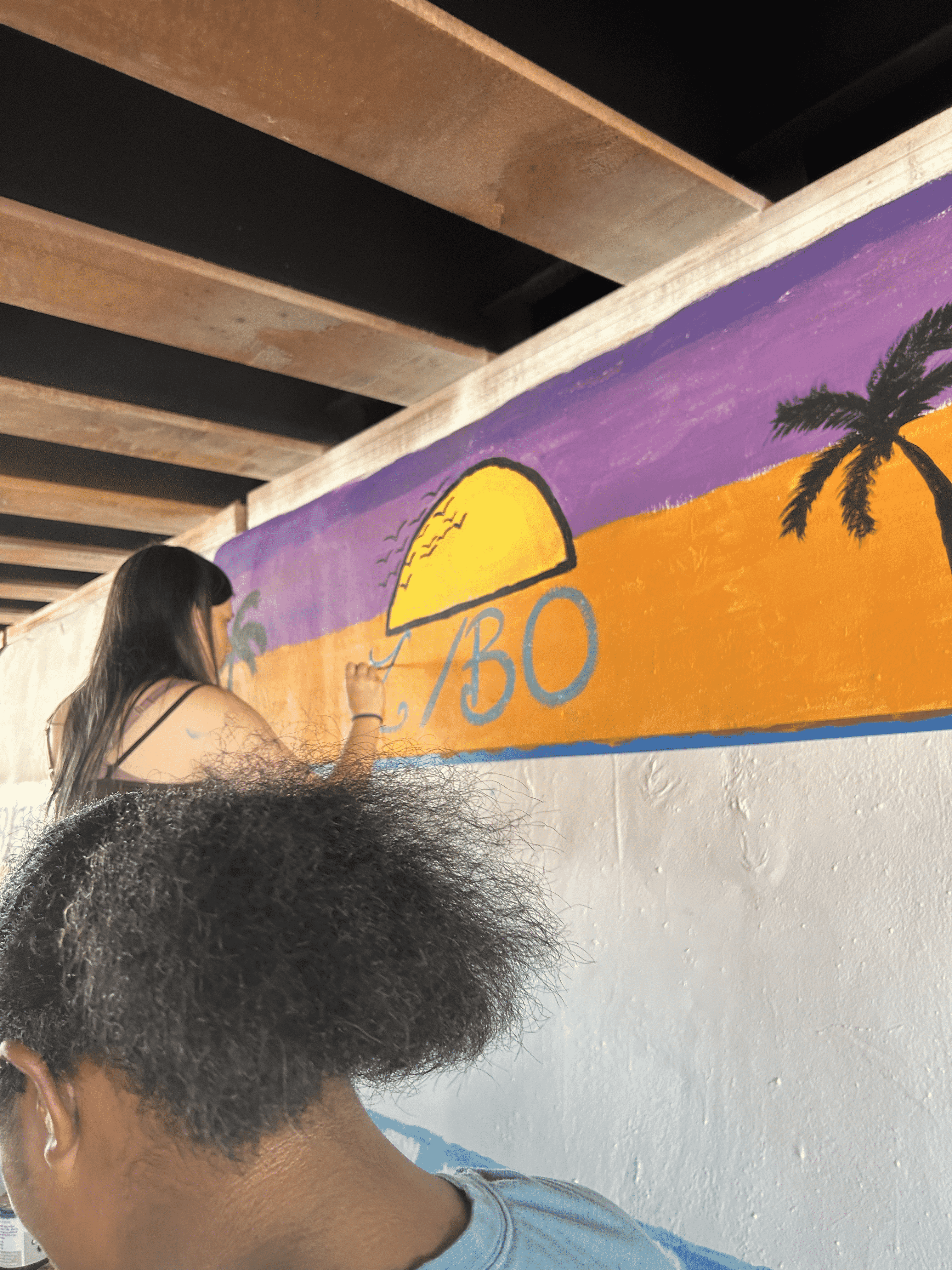 Students painting underpass.