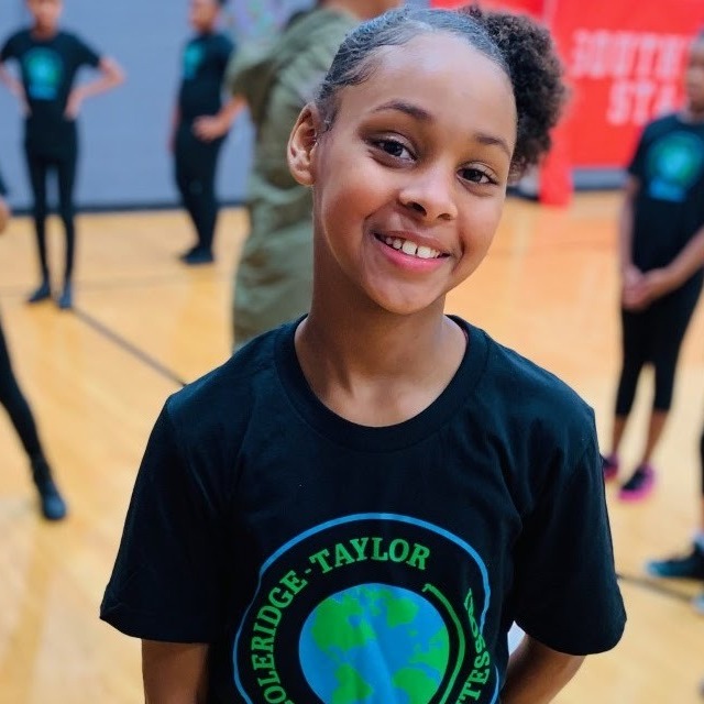 Student smiling in gym