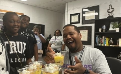 Students posing with food