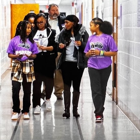 Students walking down hallway