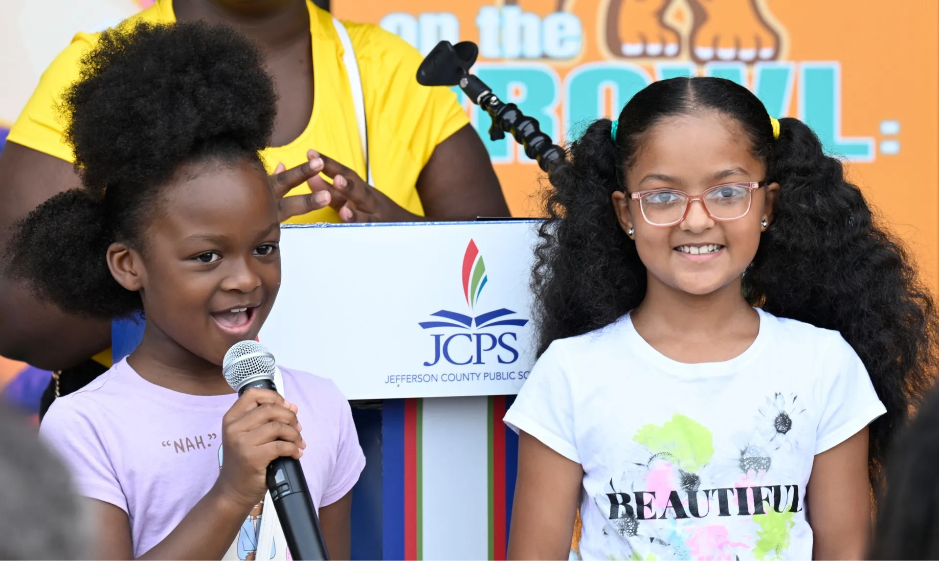 Two students on stage