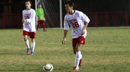 Two soccer players in mid-game on the field.
