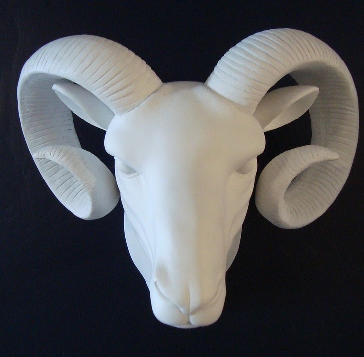 A striking statue of a ram's head.