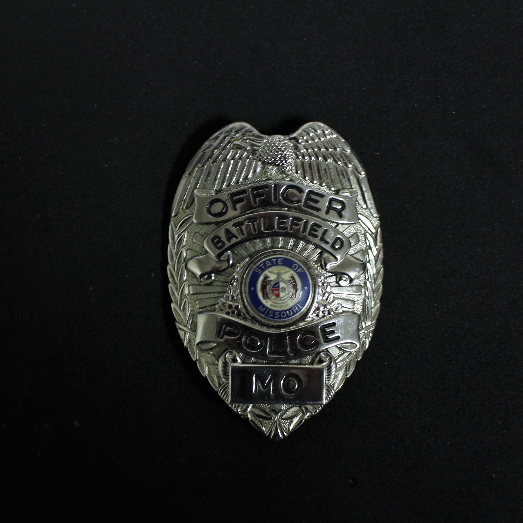 A photo of the badge of a Battlefield Police Department officer.