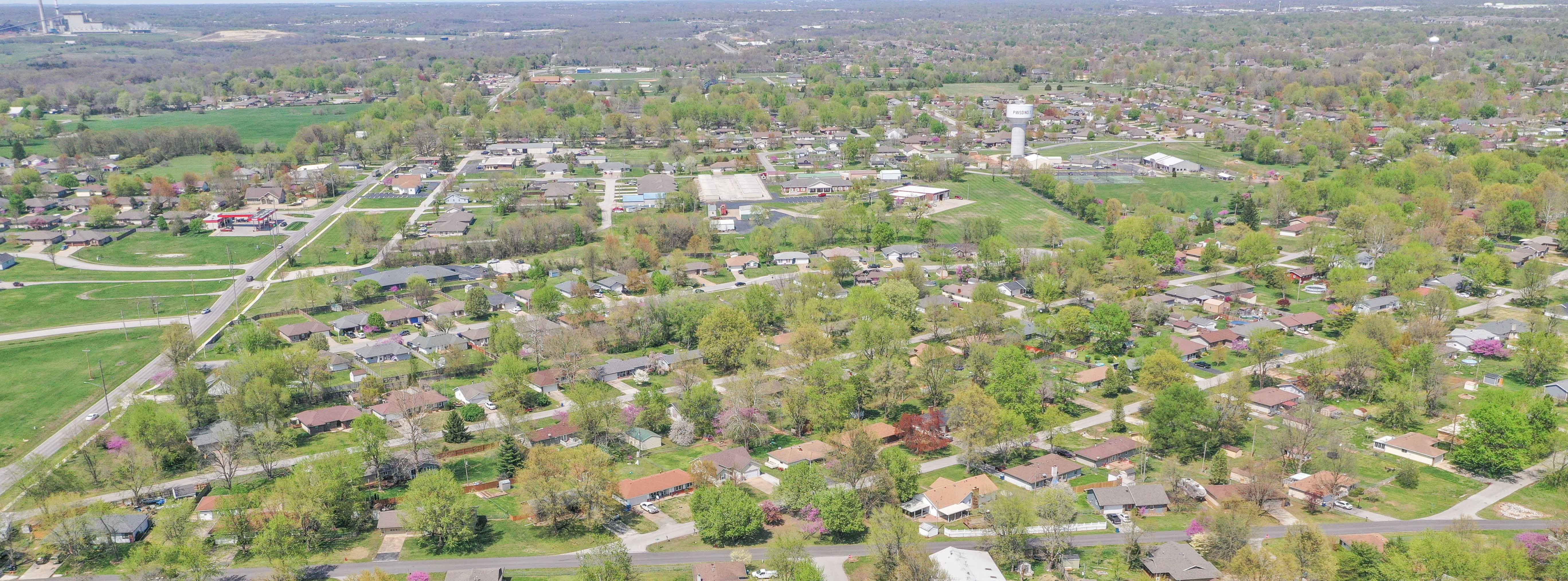 An areal photo of Battlefield looking north with houses below.
