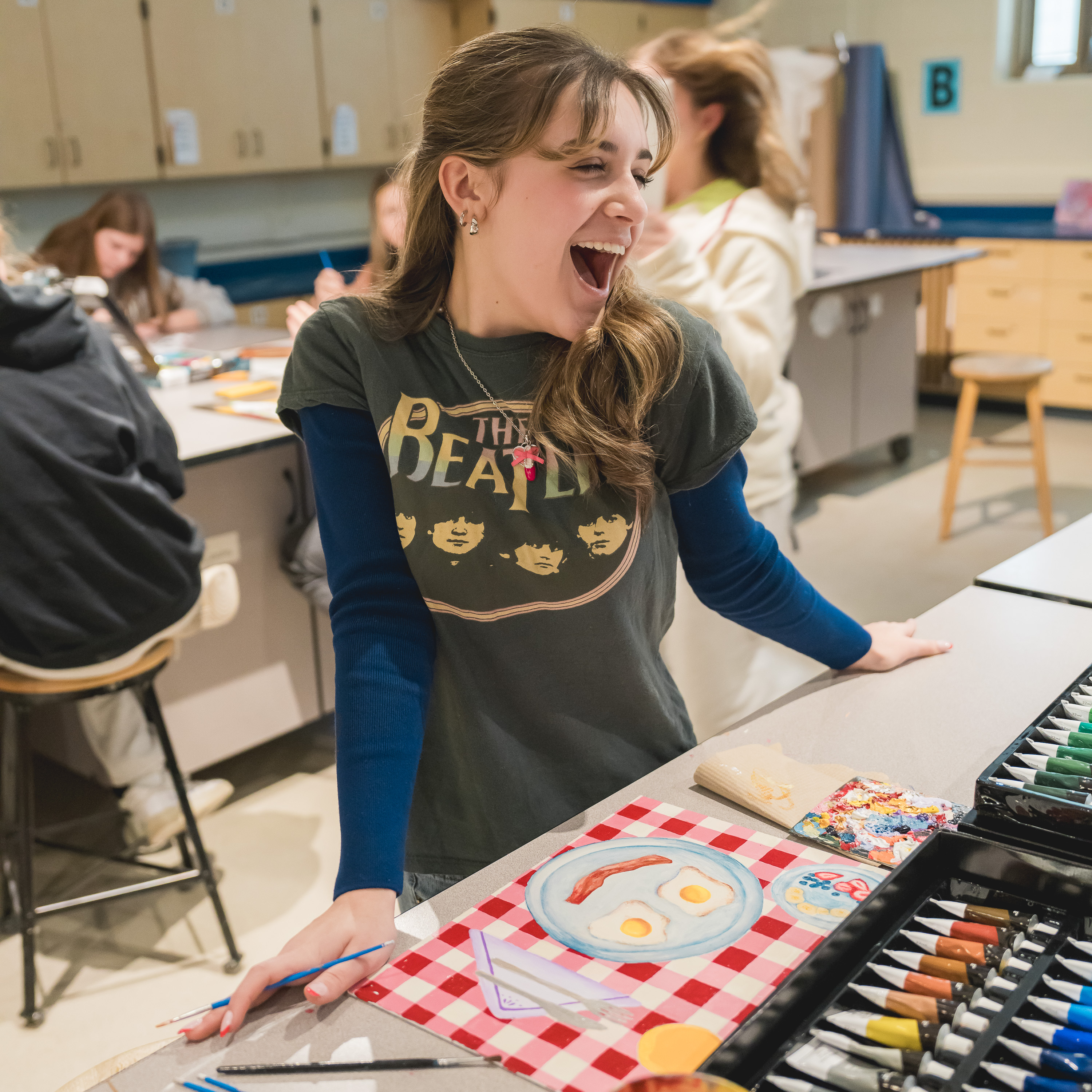 St Joseph high school student having a good time while working