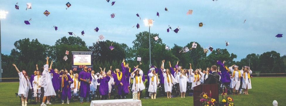 2026 graduates tossing their caps
