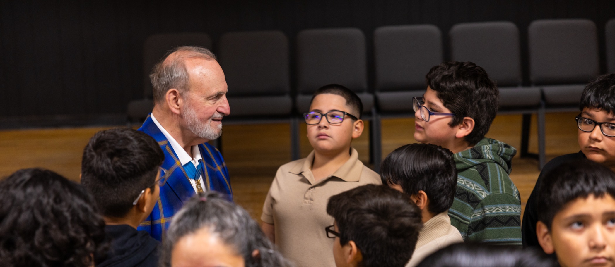 Medal of Honor recipient Brian Thacker  talks with Gus Garcia University School students.