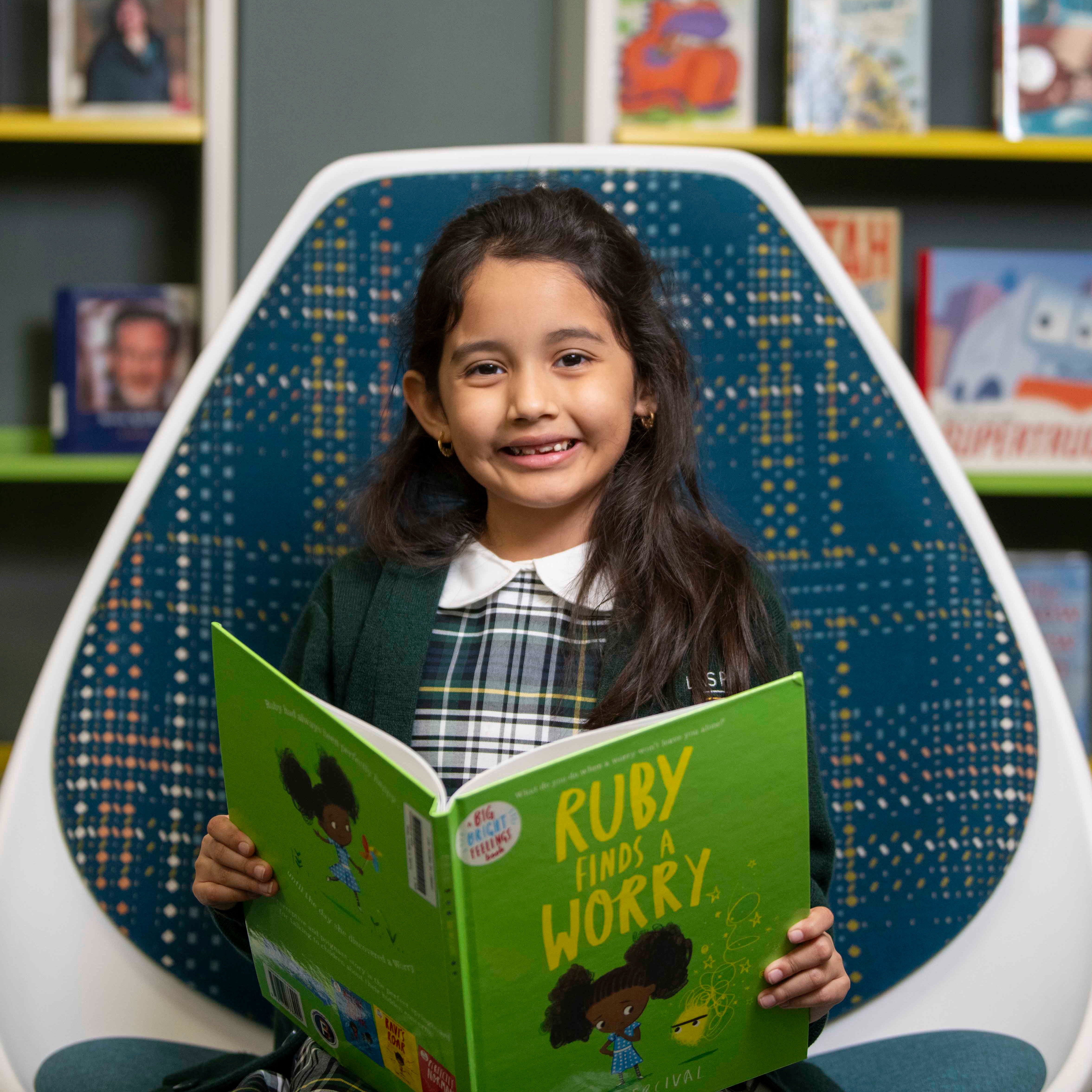 Photo of a student reading a book in the LPLSG library