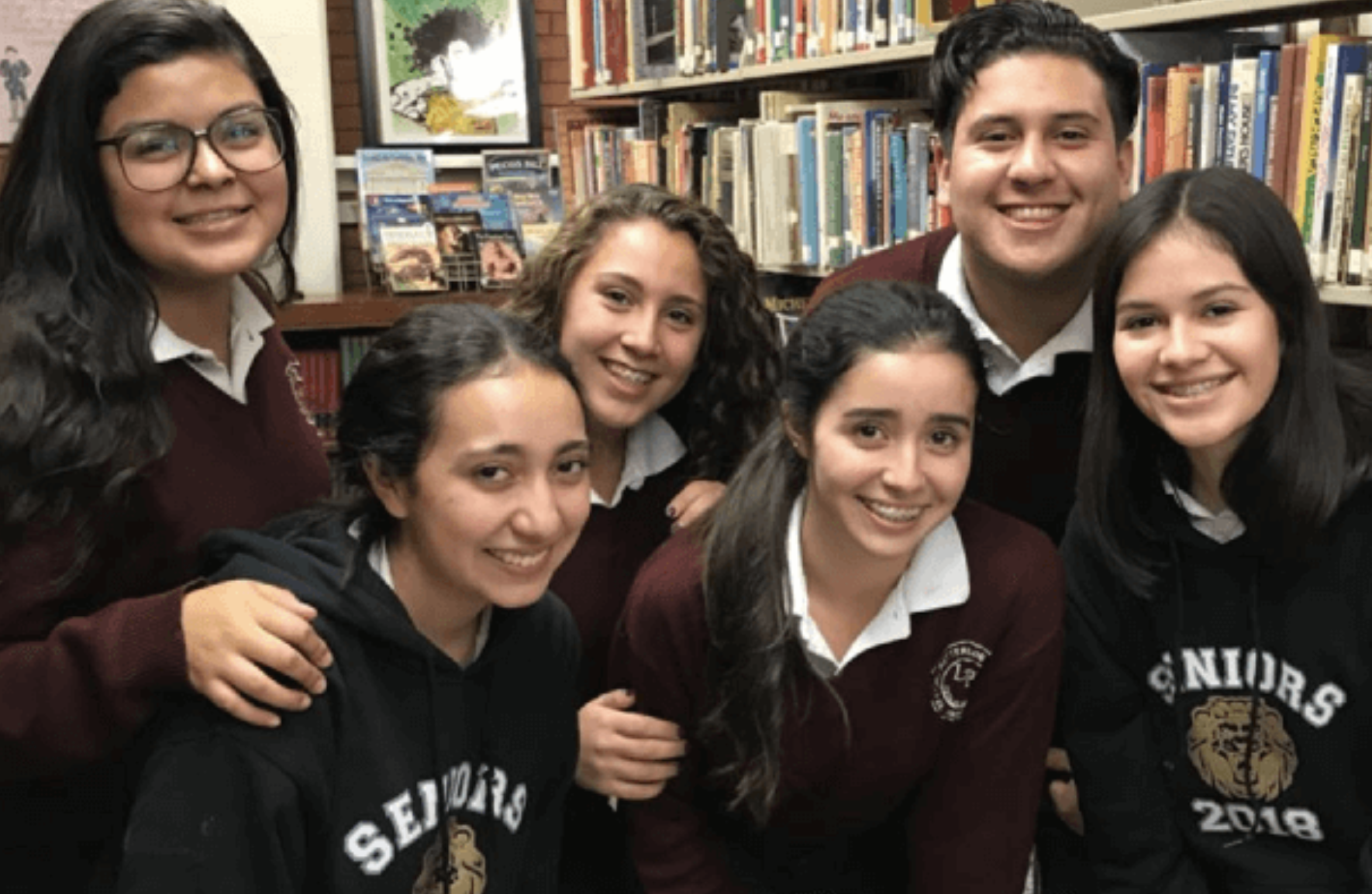 A group of senior students smiling for the photo