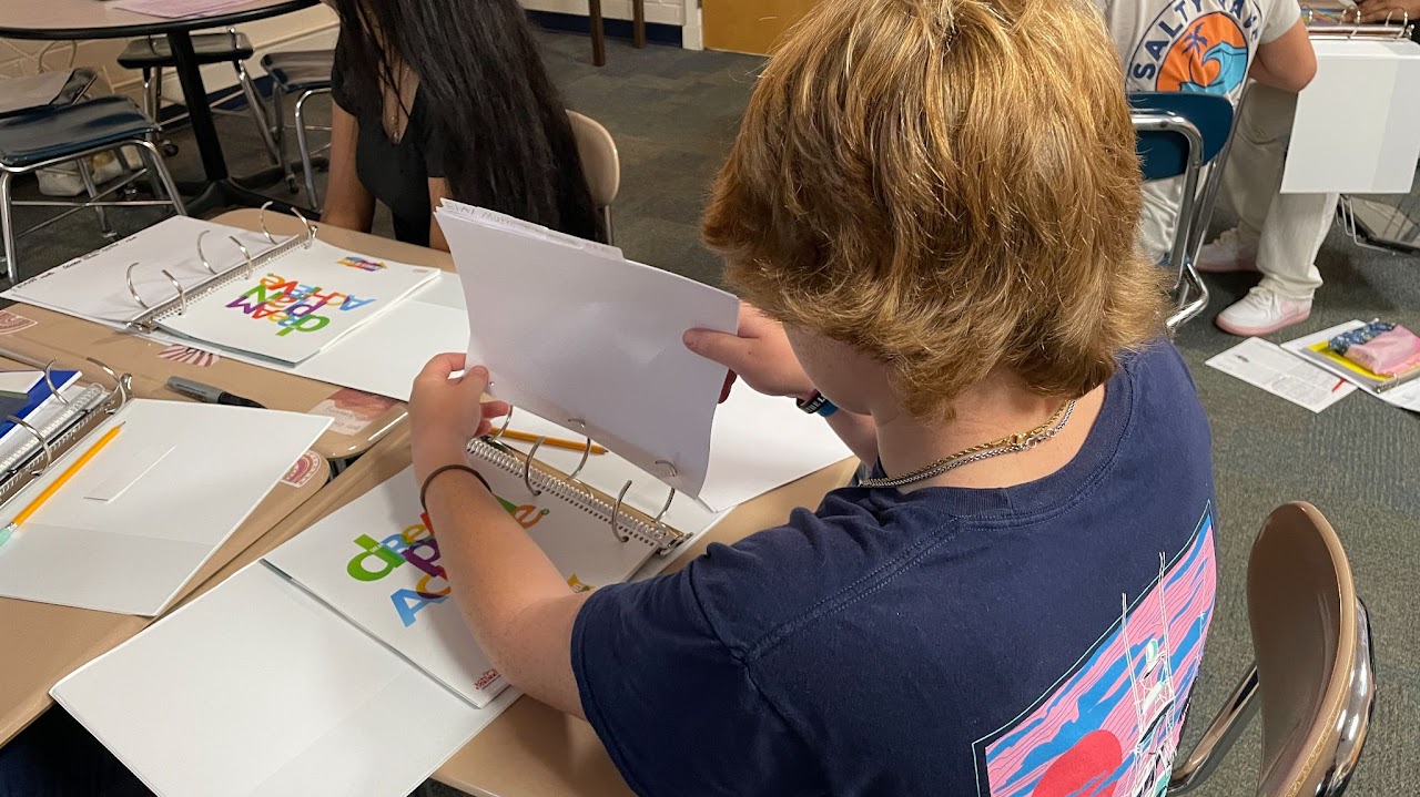 AVID Student Reviewing Binder