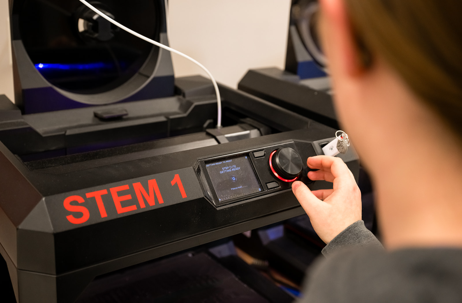 student using machine in classroom