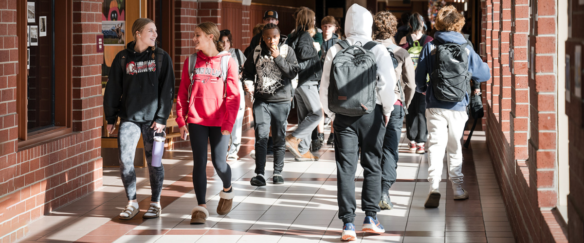 students between classes walking through the halls