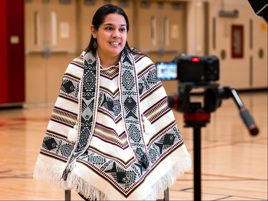 Betty Vazquez, Supervisor of English Language and Bilingual Eduaction sitting in front of a camera being interviewed