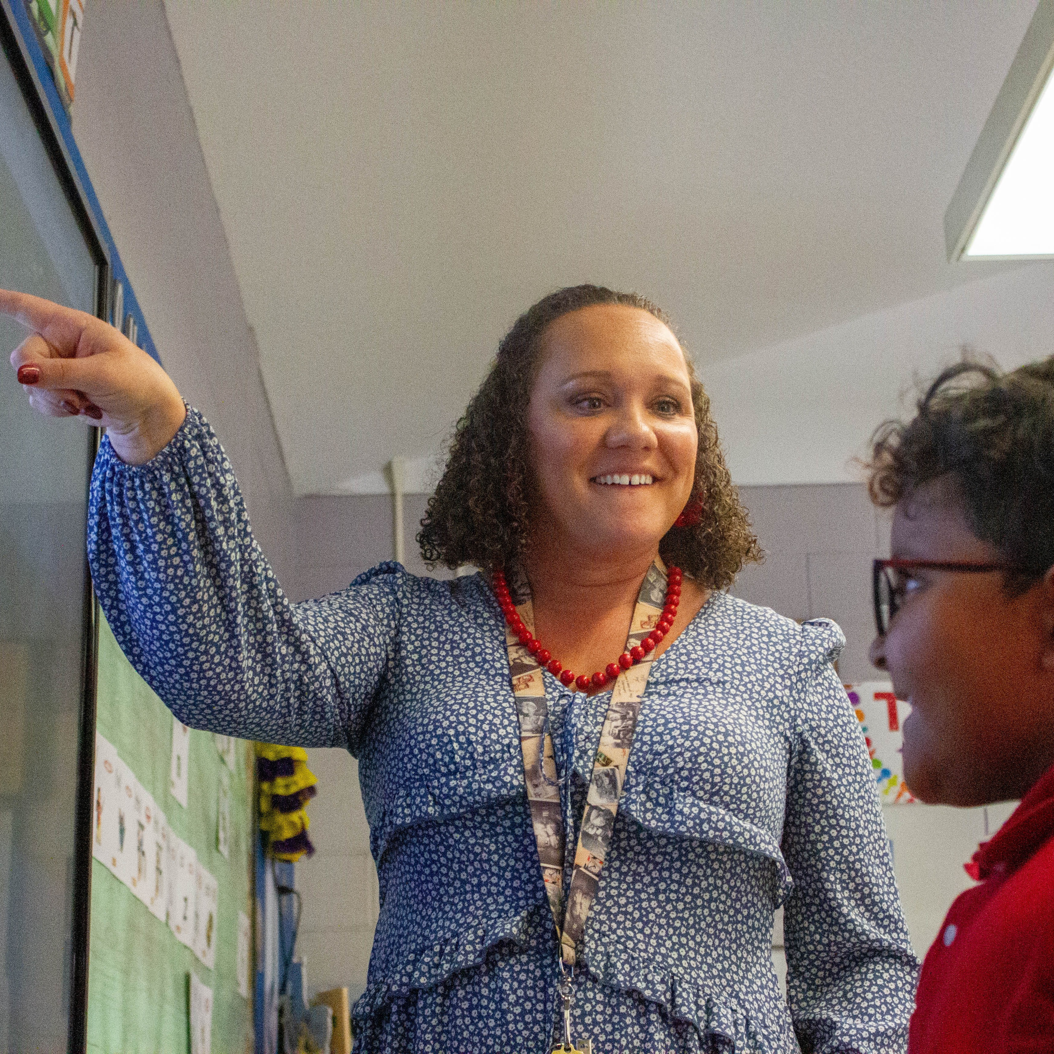 Ms. Simpson works with Jonah P. on an AIG enrichment assignment for first graders.