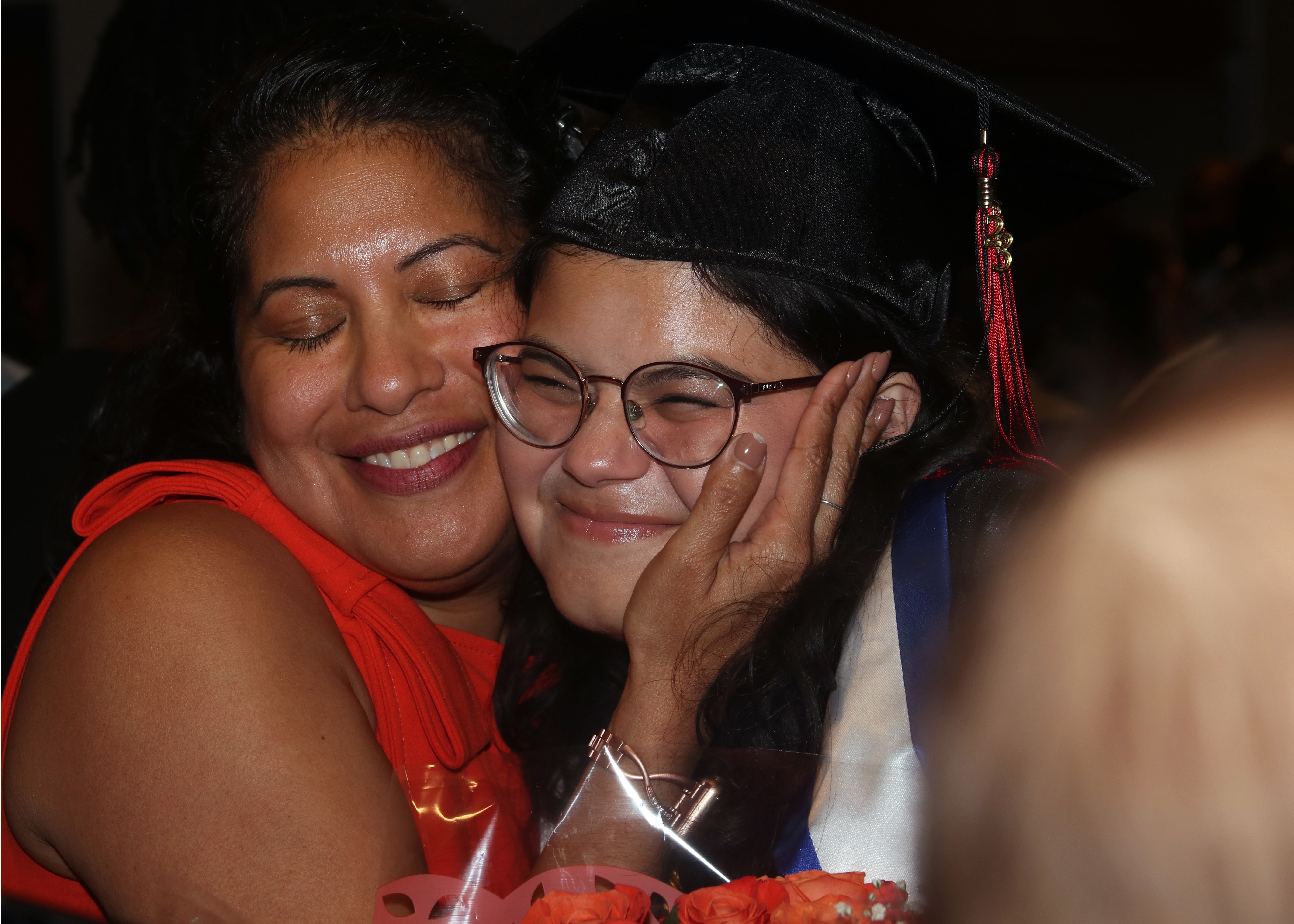 Parent embraces a graduate at Lee Early College Graduation in 2023.