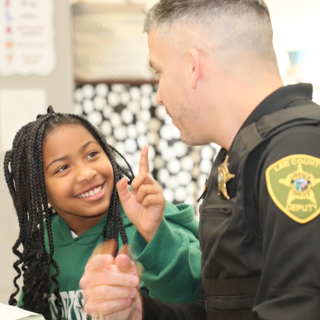 Kid interacting with School Resource officer