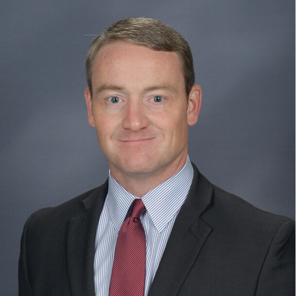 Dr. Wesley Hester in suit and red tie