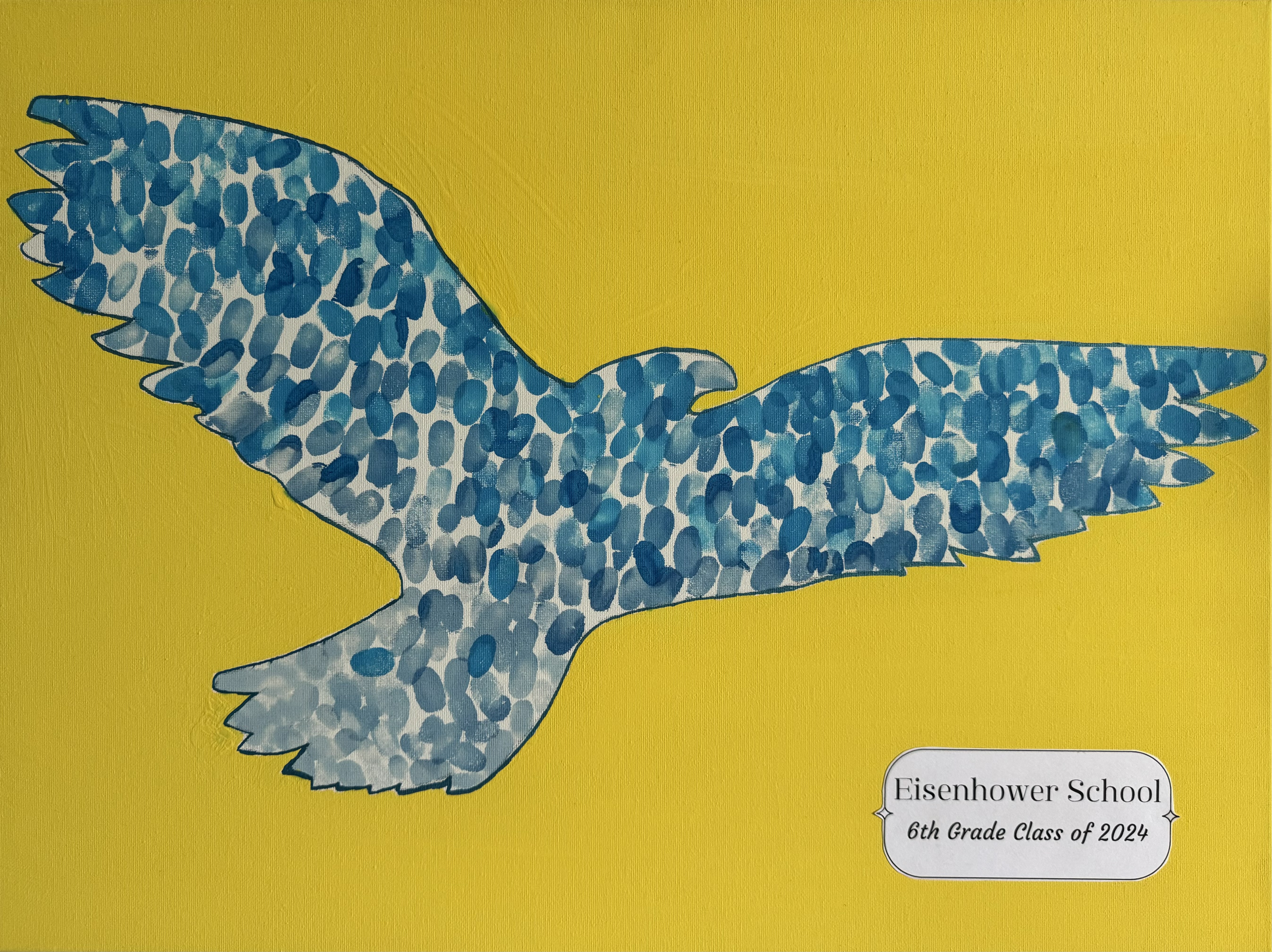 Outline of an eagle filled with student thumbprints in blue ink