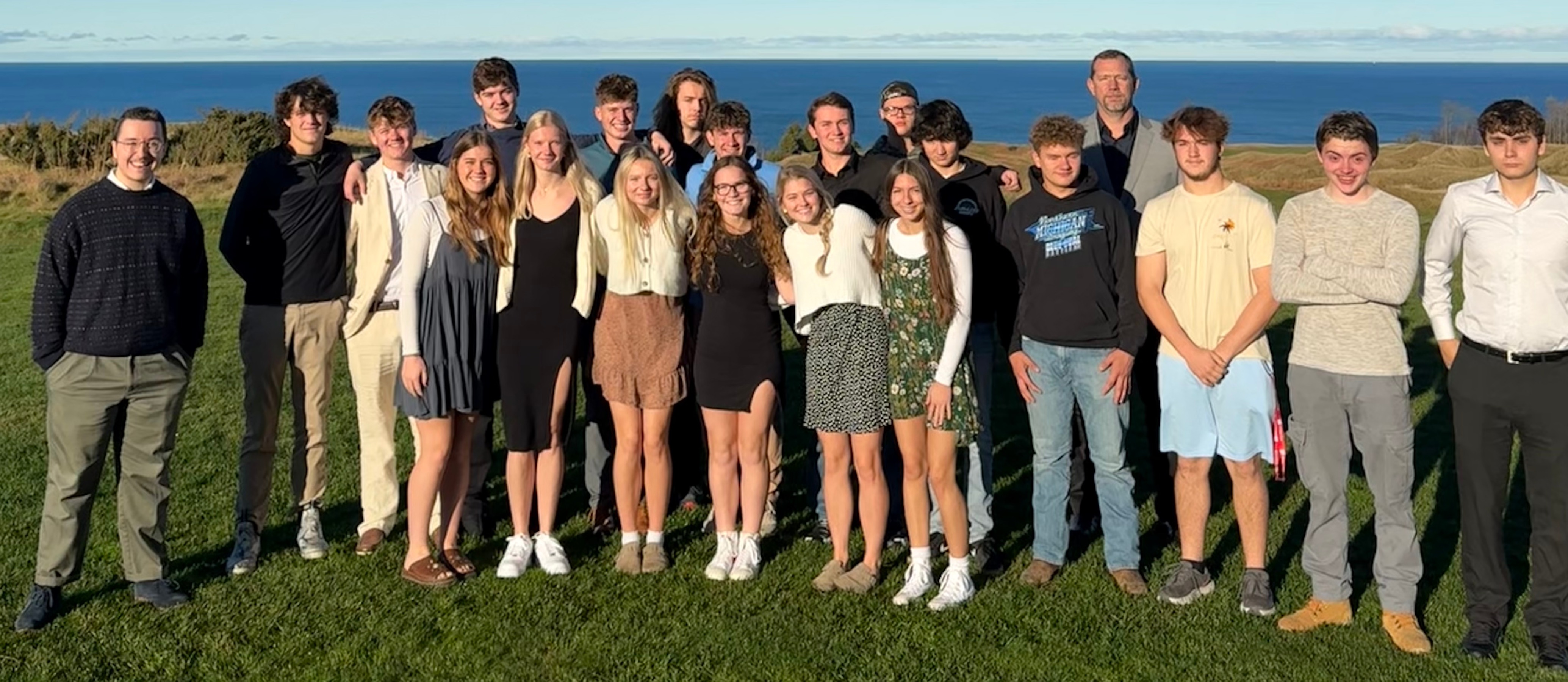 Onekama's class of 2025 poses with principal Dave Huntington and homeroom teacher Zane Harding.