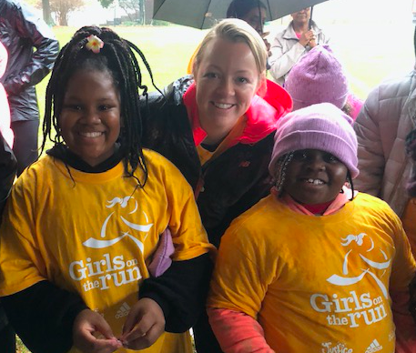 students and school staff smiling for a picture