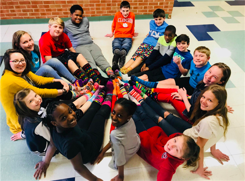 Children sitting down in a circle