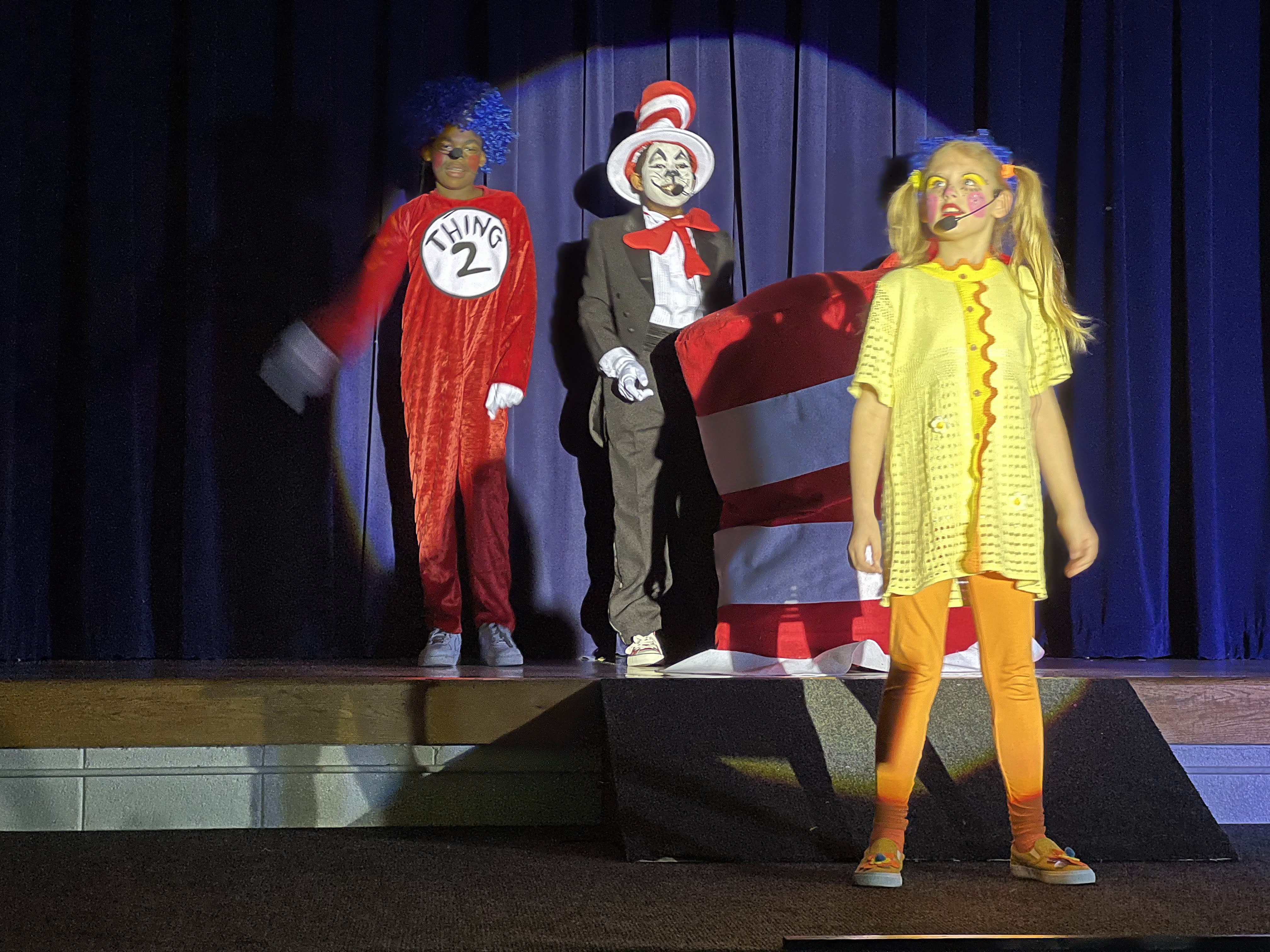 characters on stage in costume