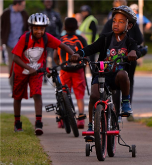 Boys with a bicycle