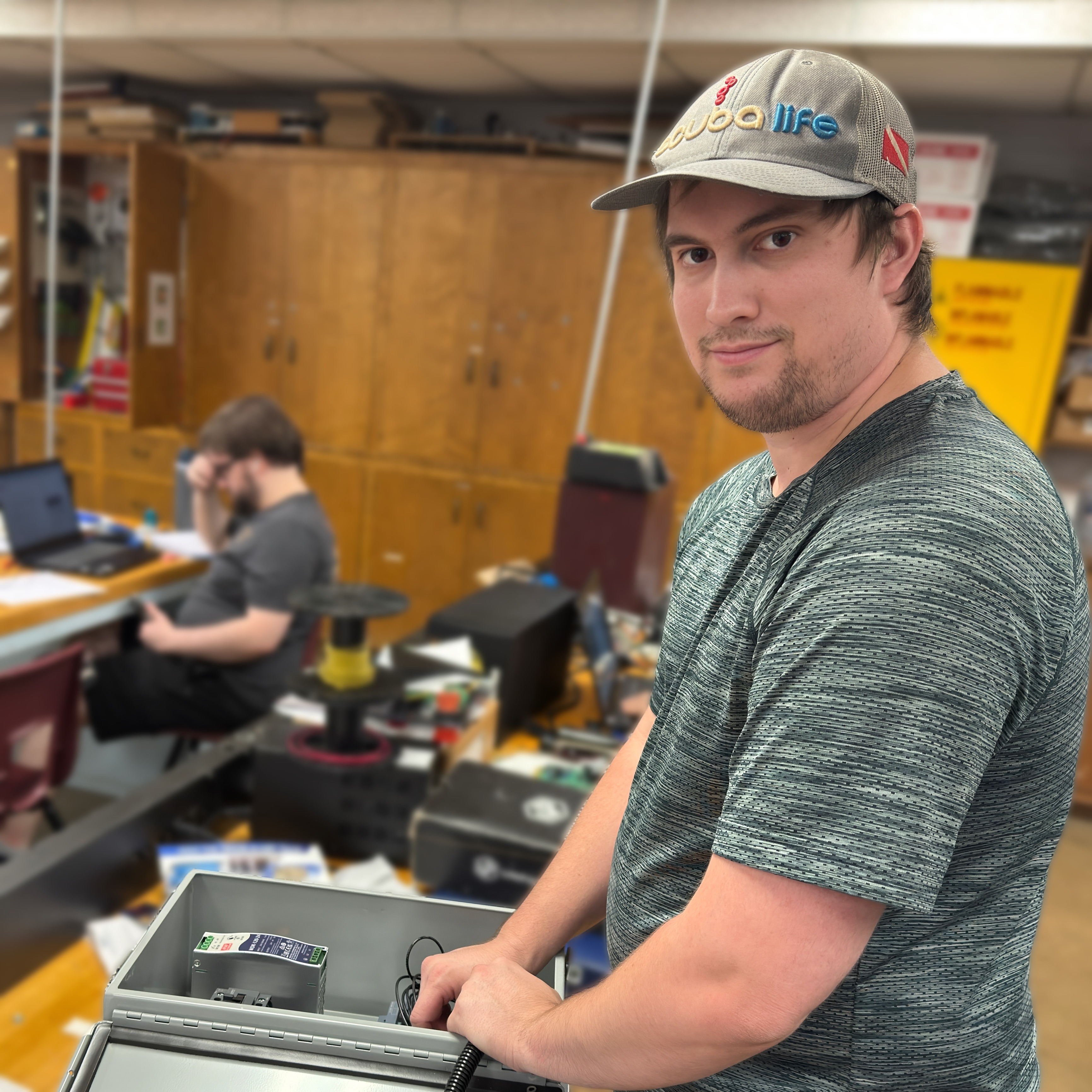 Electronics student Garrett Burger works on a control panel