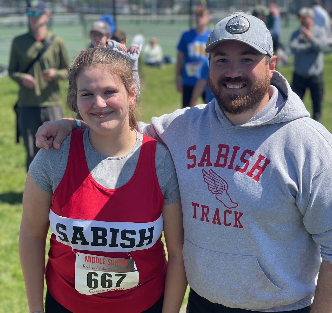 student and coach smiling