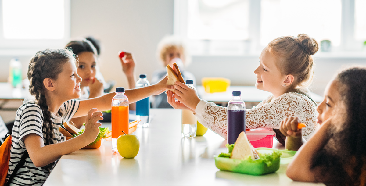 picture of children eating in cafeteria