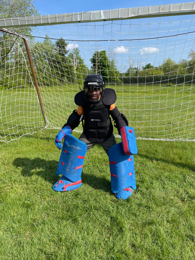 kid with goalie uniform