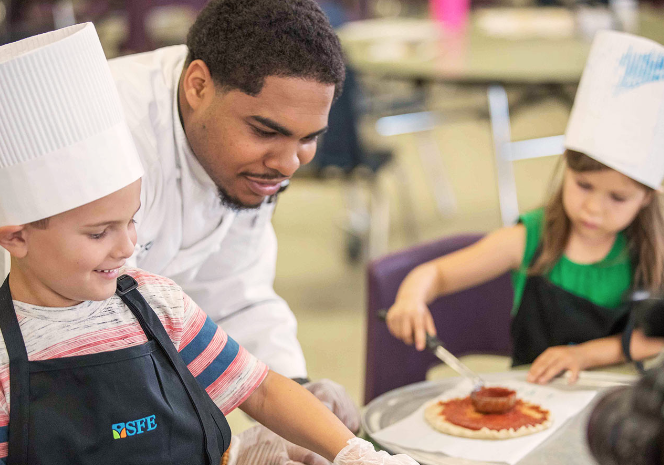 Children learning to cook 