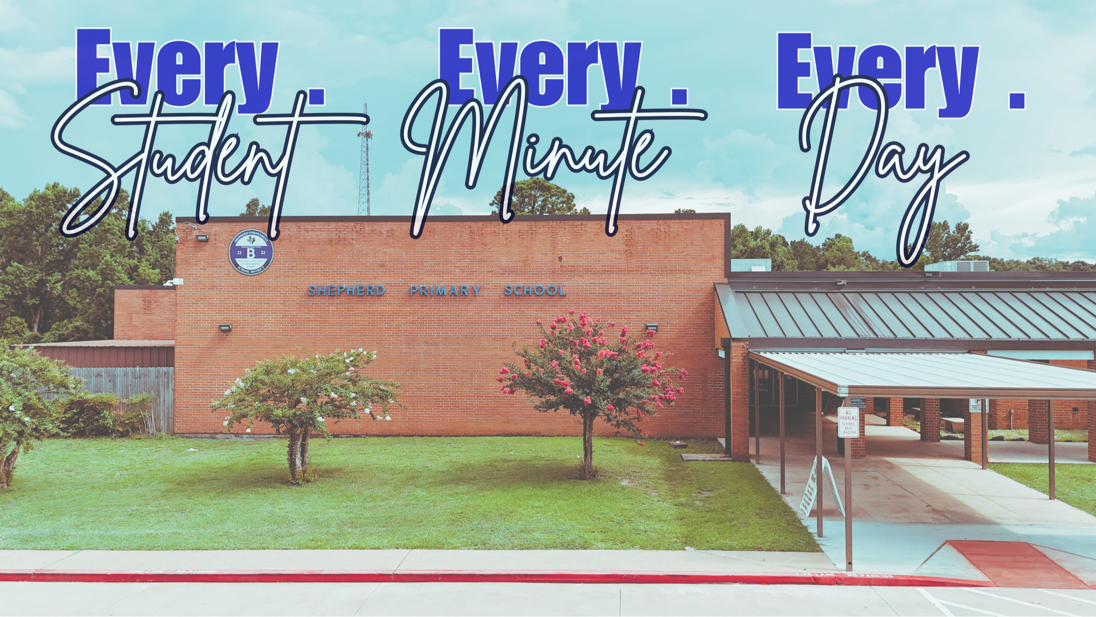 A school building with "Every Student Every Minute Day" text, greenery, trees, and a metal roof.
